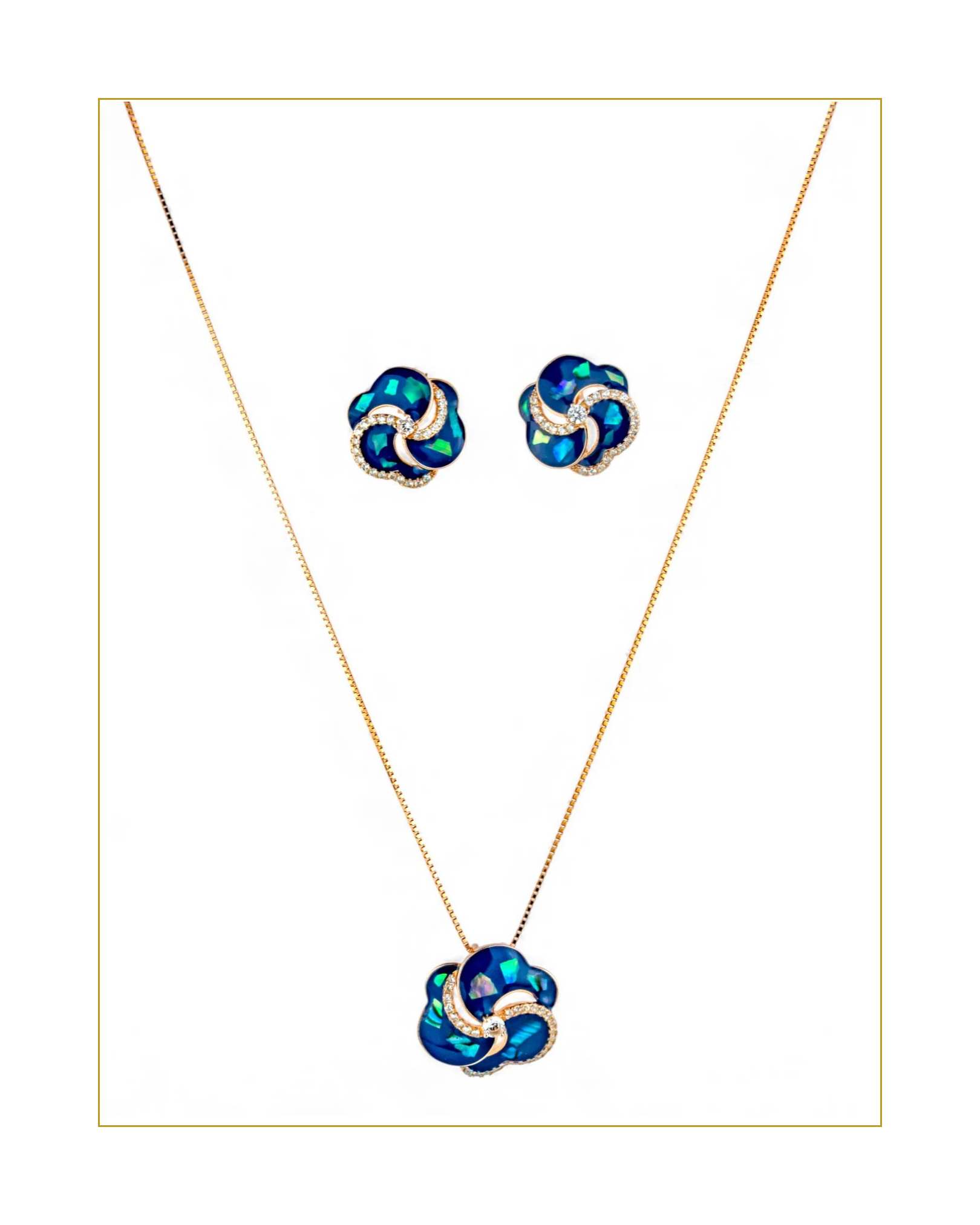 Jewelry set with blue and gold necklace and earrings on a white background