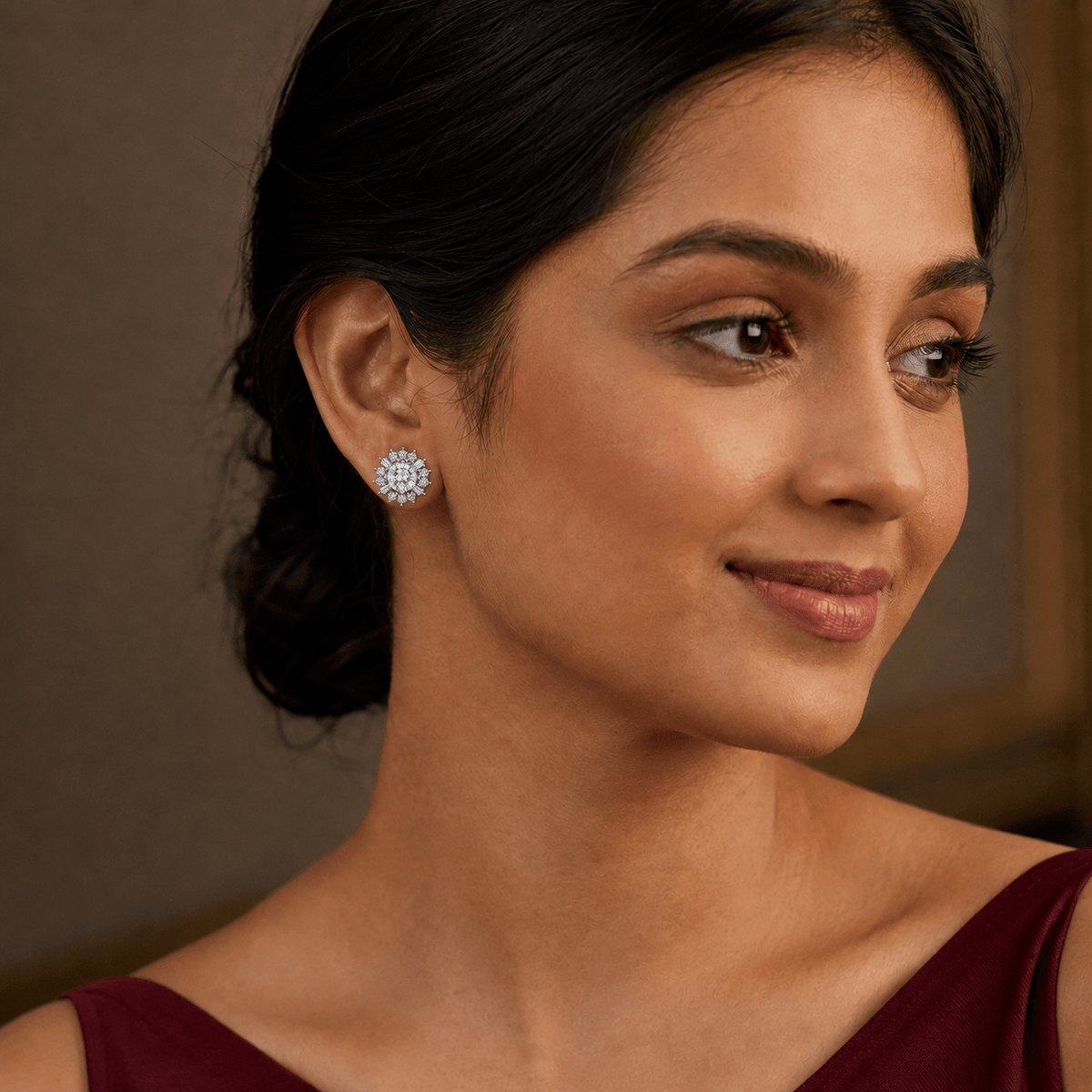 A woman wearing a small round stud 925 Silver Sunburst Halo Stud Earrings