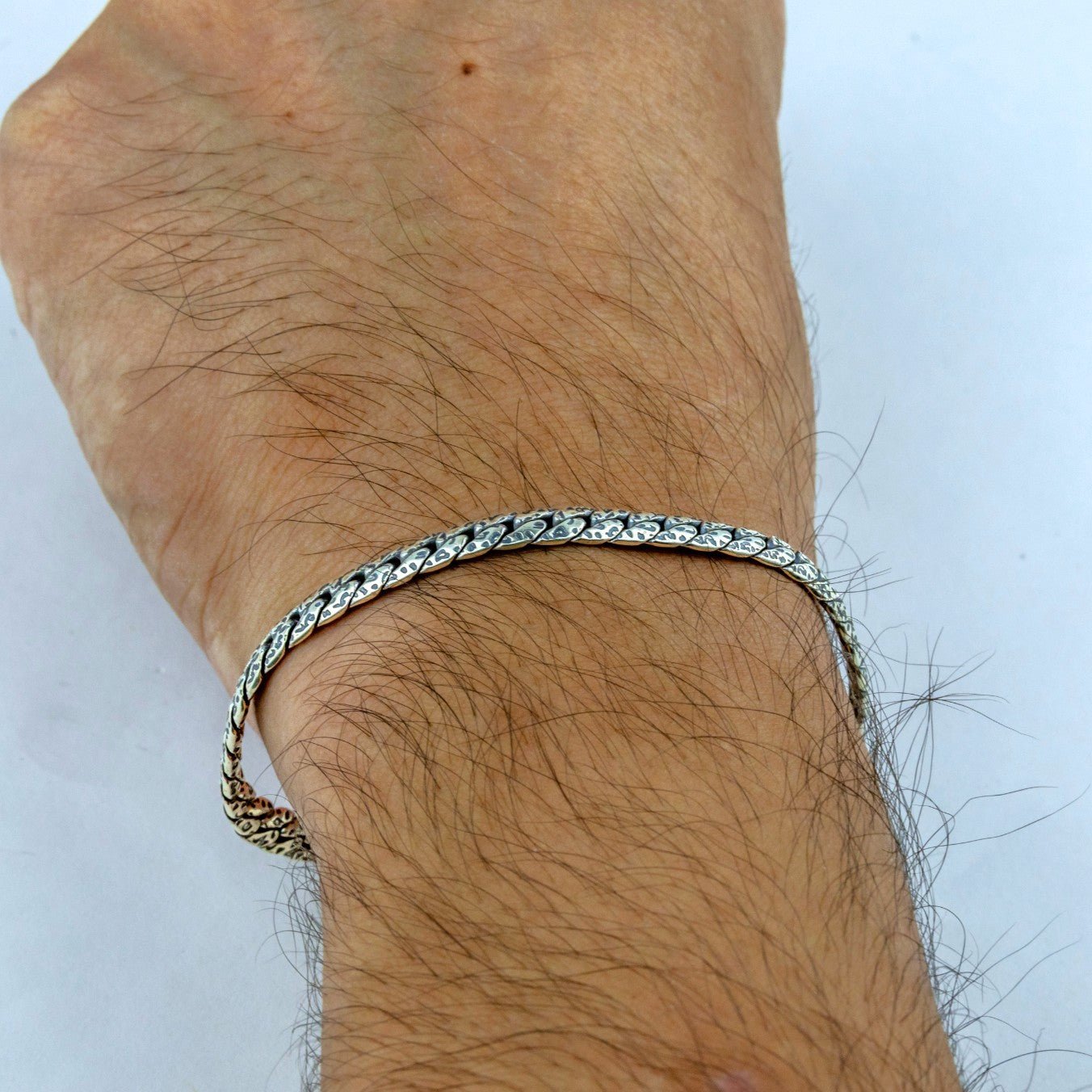 Byzantine Chain Bracelet -on a person's wrist against a light background - Miraura Jewels