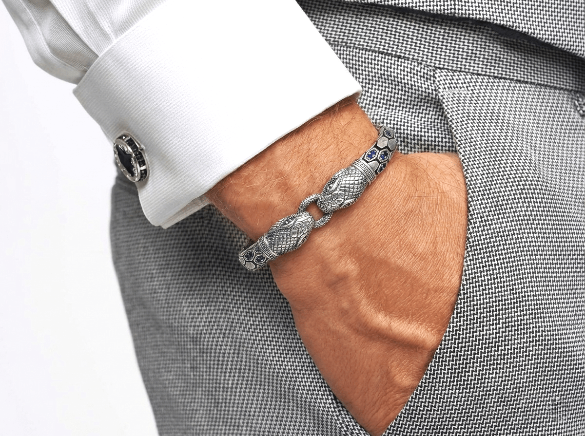 Close-up of a person wearing Double - Headed Snake bracelet by Miraura Jewels