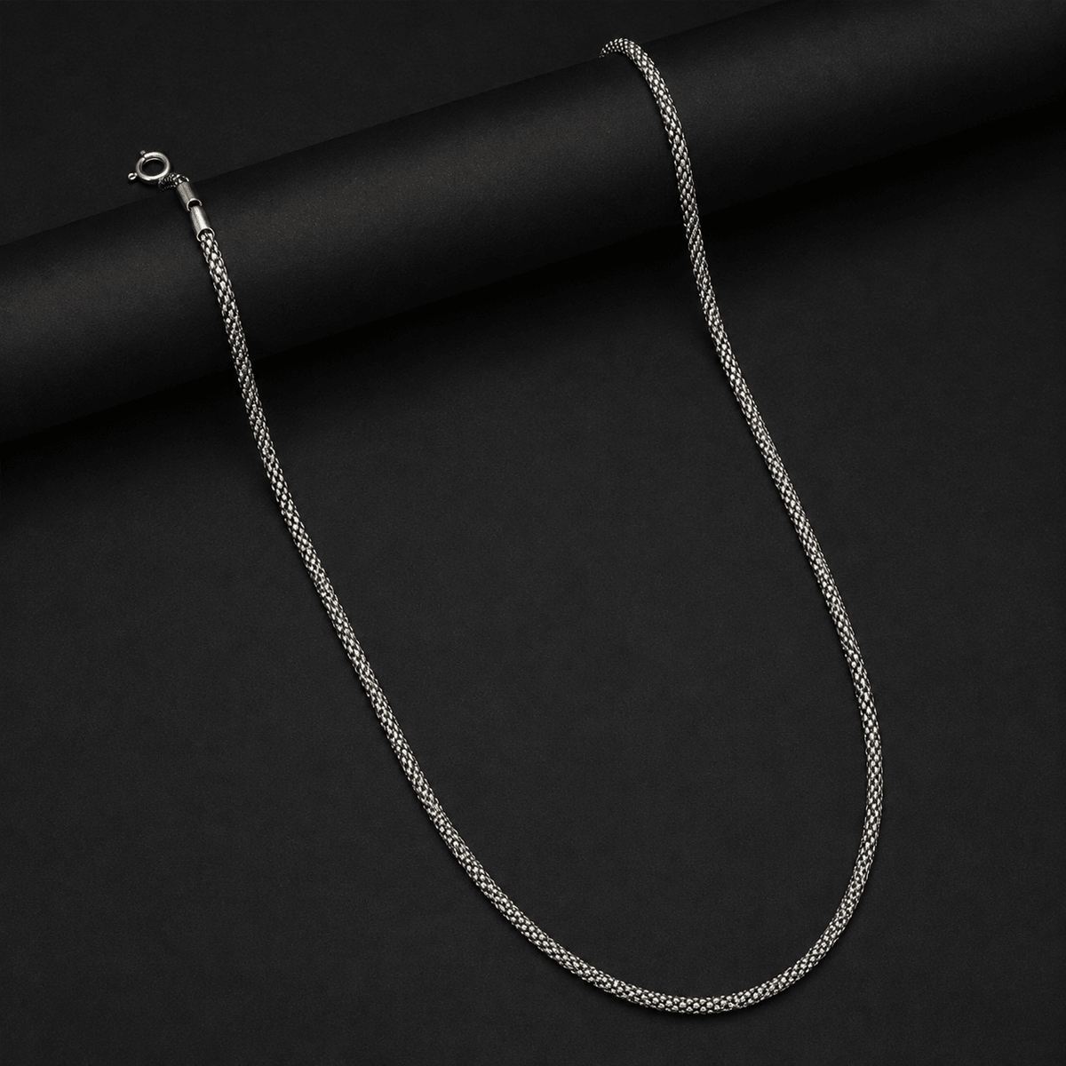 A silver-toned 925 Silver chain necklace with a lobster clasp. Men's 925 Sterling Silver Woven Popcorn Chain - Miraura Jewels
