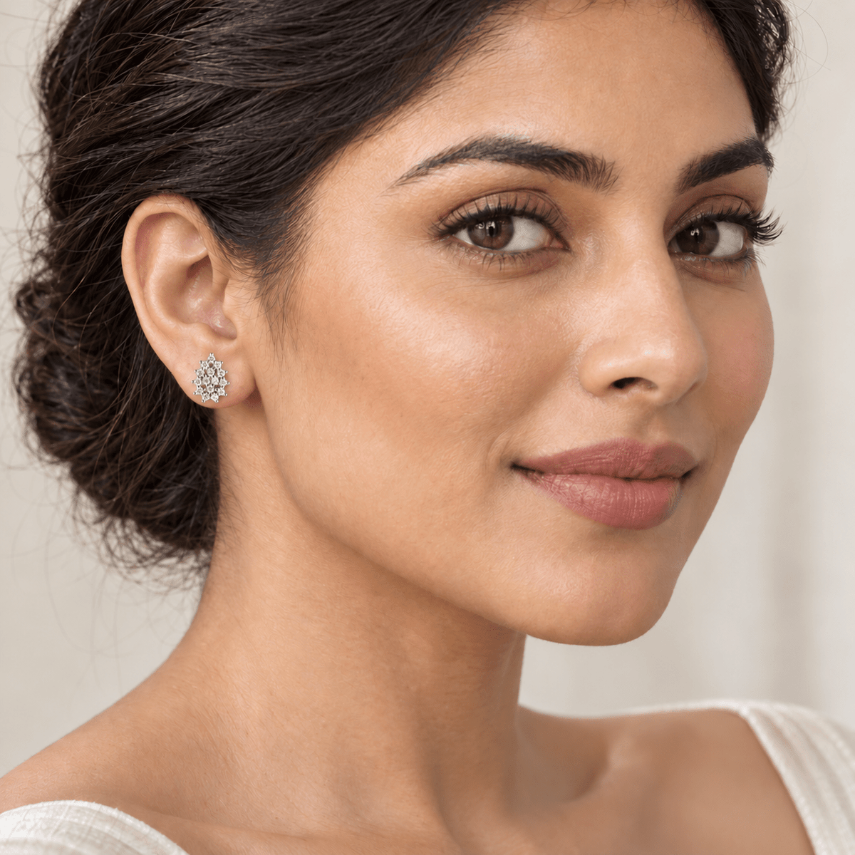A woman wearing a small Silver Pavé Orbit Earrings | 925 Silver by Miraura Jewels