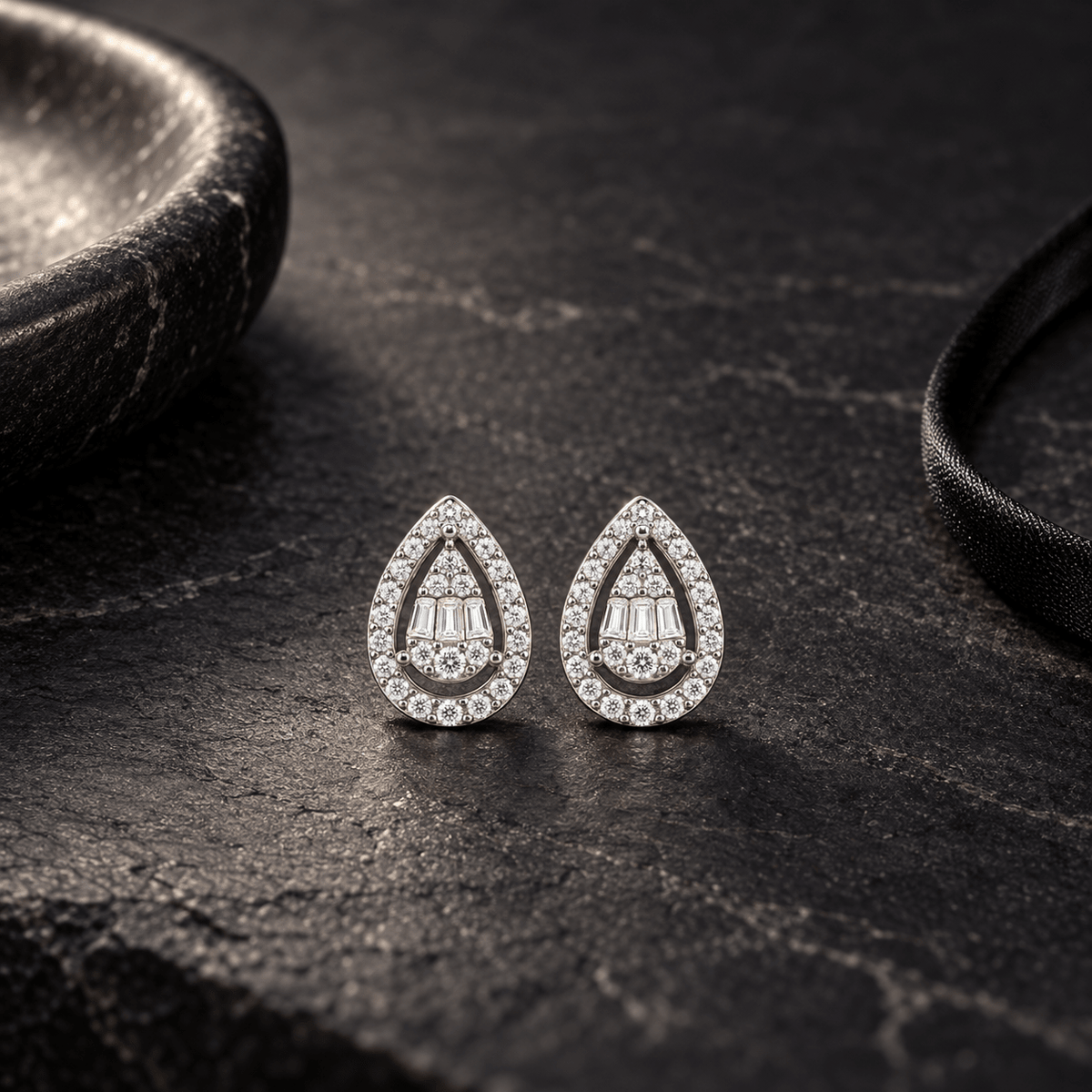 Studio Shot of 925 Silver Baguette Halo Teardrop Studs by Miraura Jewels