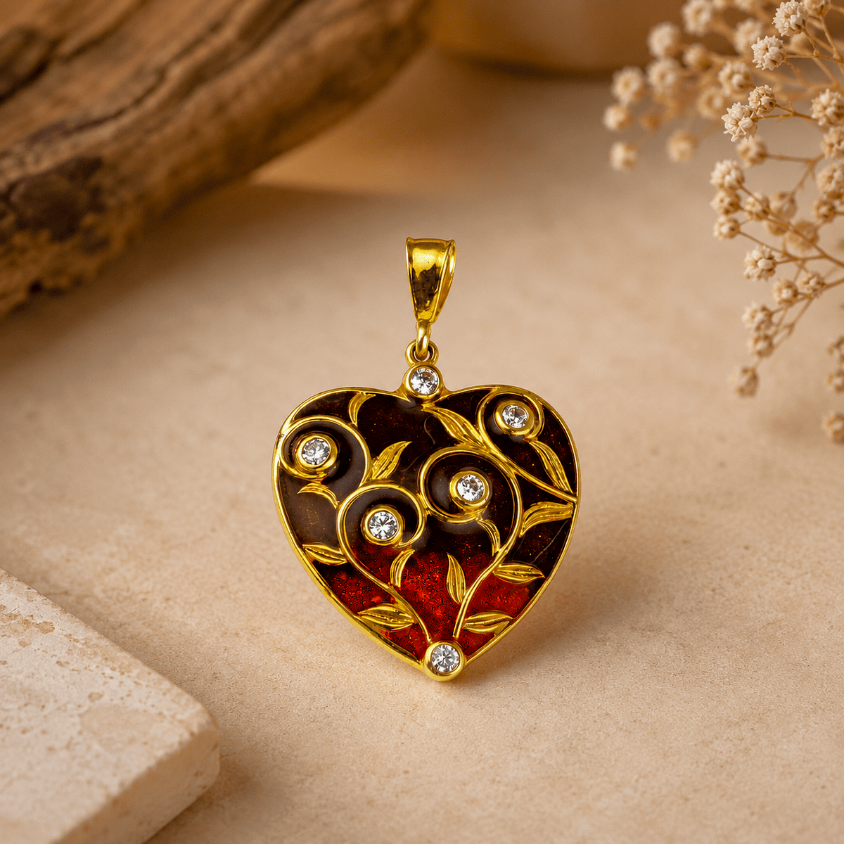 A heart-shaped gold pendant with red  enamel details, decorated with small clear gemstones, 925 Silver Ombre Red Heart Enamel Pendant by Miraura Jewels.