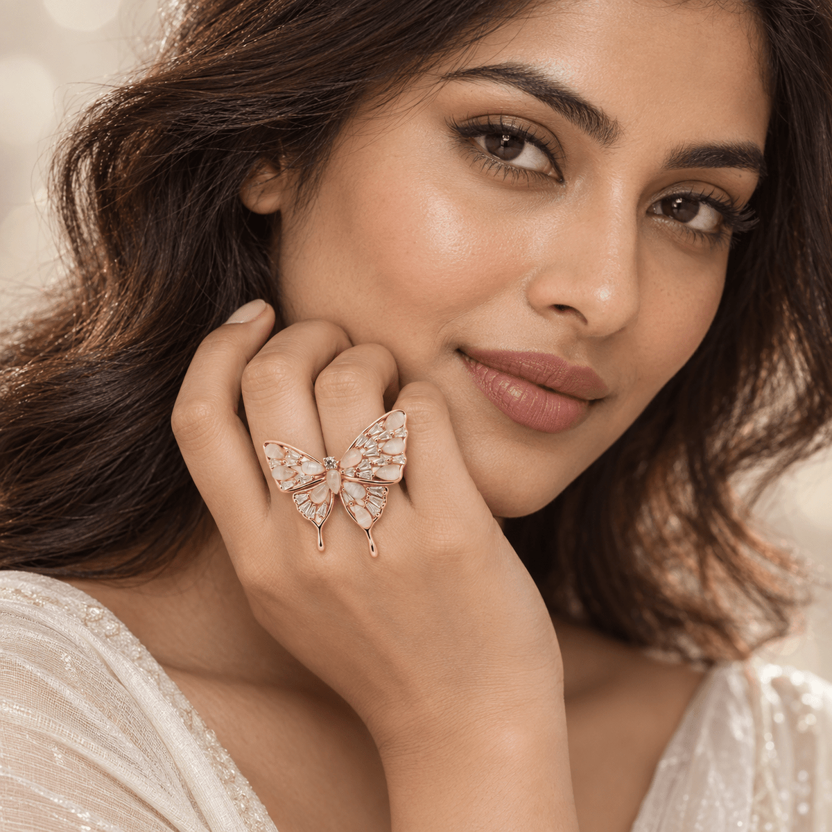 A  woman wearing a 925 Sterling Silver Polished Stone Butterfly Ring | Rose Gold Plated