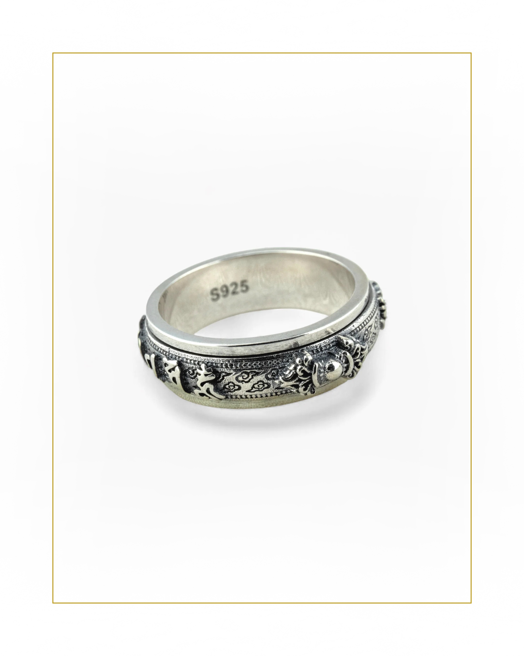 Spinner Silver ring with intricate tibetan design on a white background