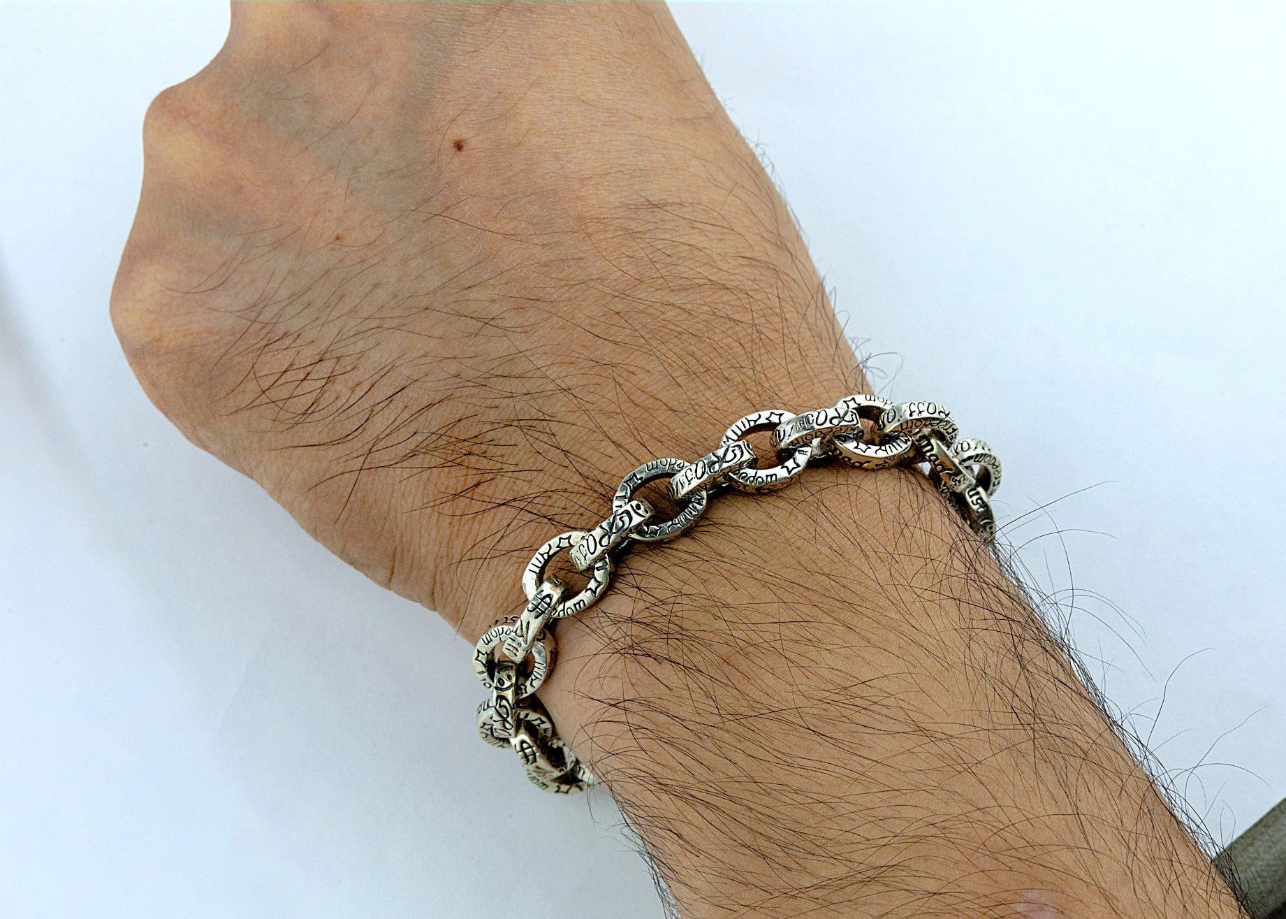 Textured Rolo Link Bracelet - Miraura Jewels on a wrist with a plain background.